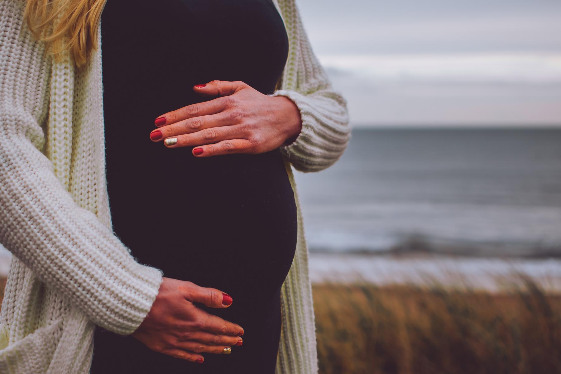 Pregnant Woman Holding Belly Fresh Manicure