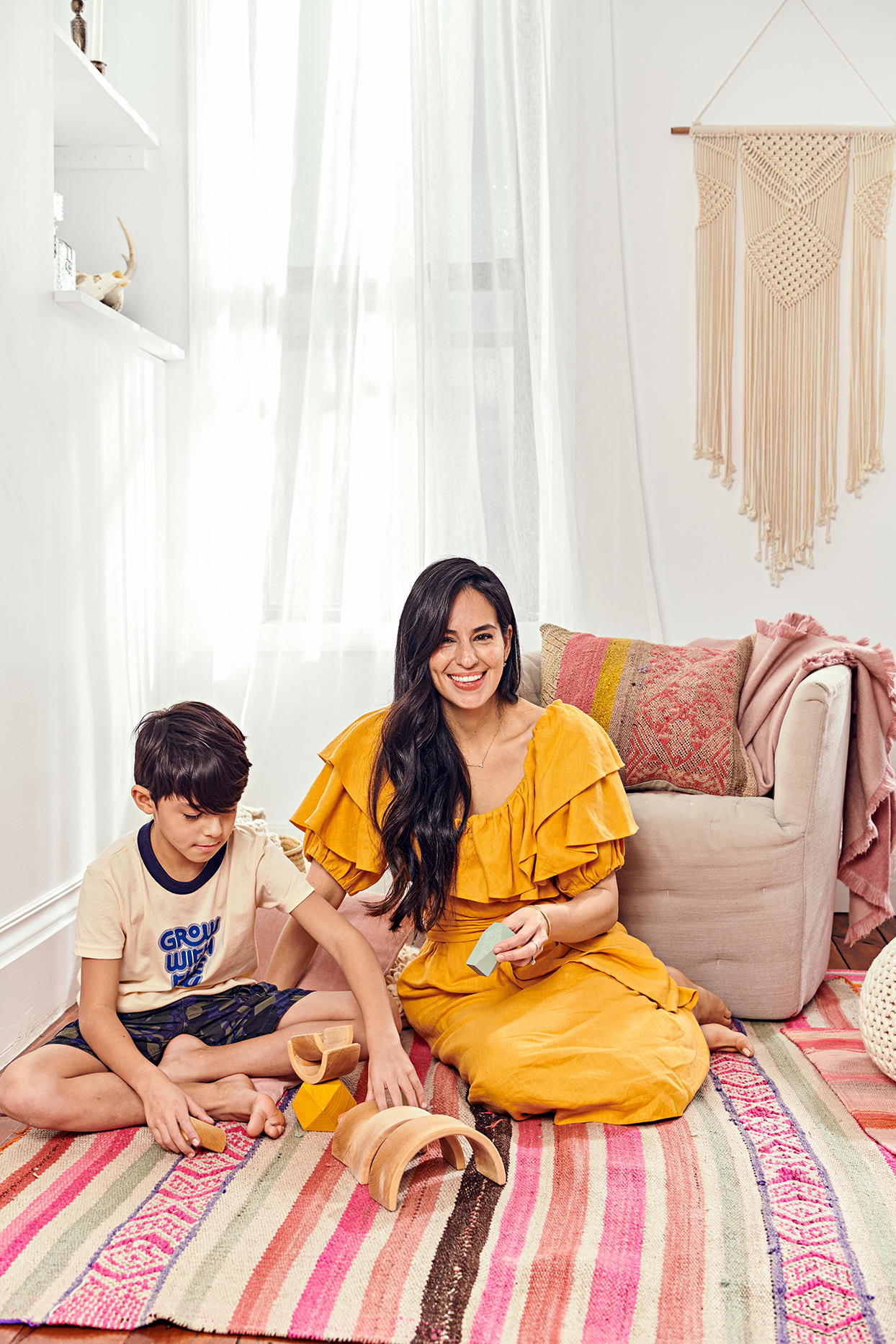 Child and parent on floor playing