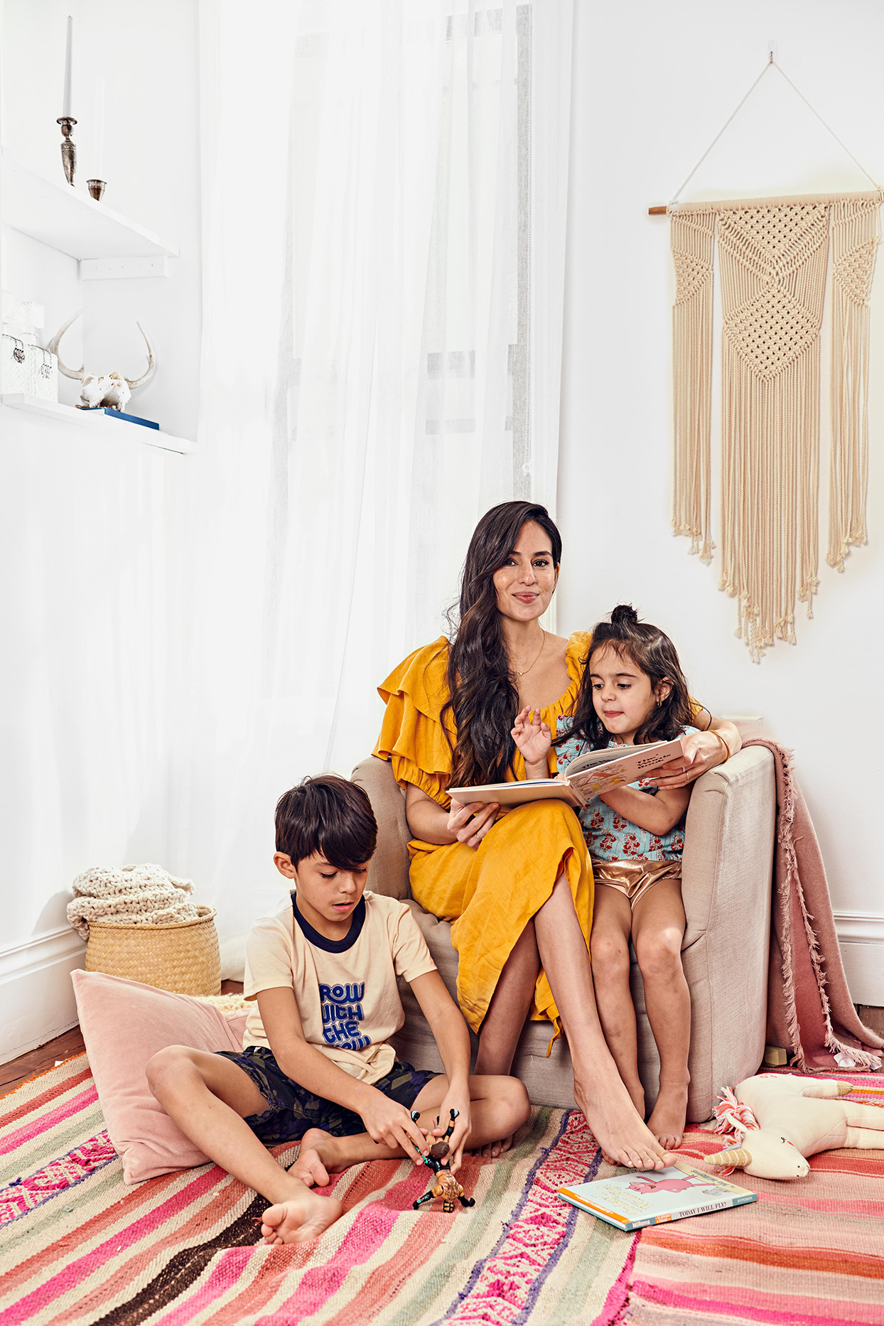 Parent reading a book to children