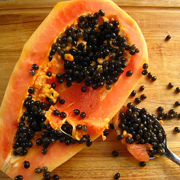 scoop out seeds of papaya