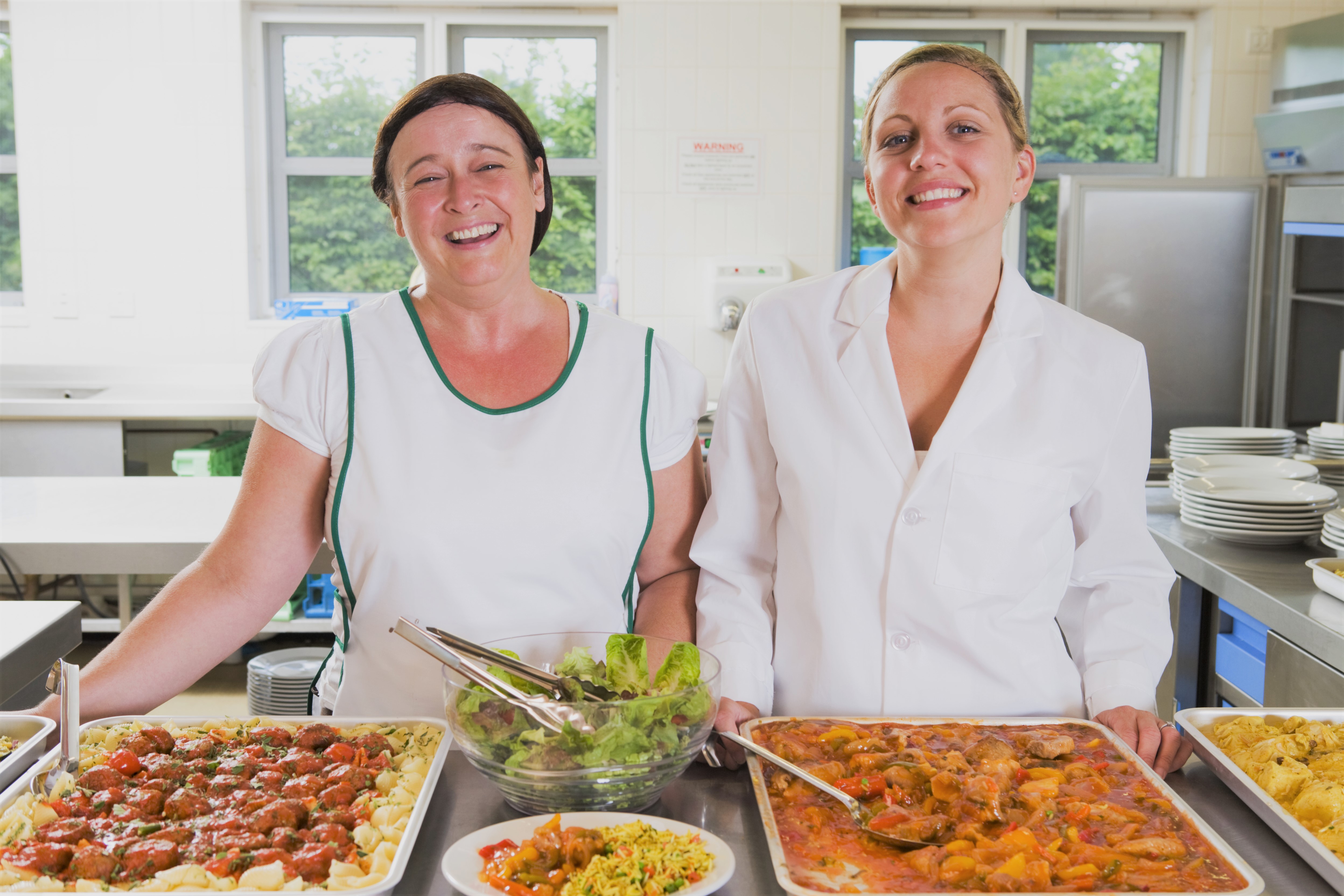 Lunch Ladies and Trays of Food