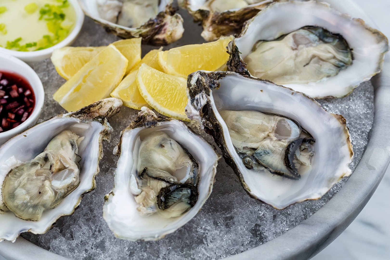 Plate of Oysters and Lemon Wedges