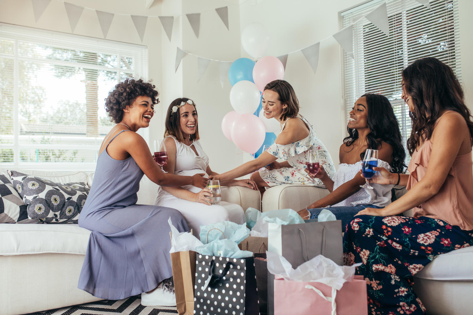 Multiethnic Friends Baby Shower Touching Belly of Pregnant Woman