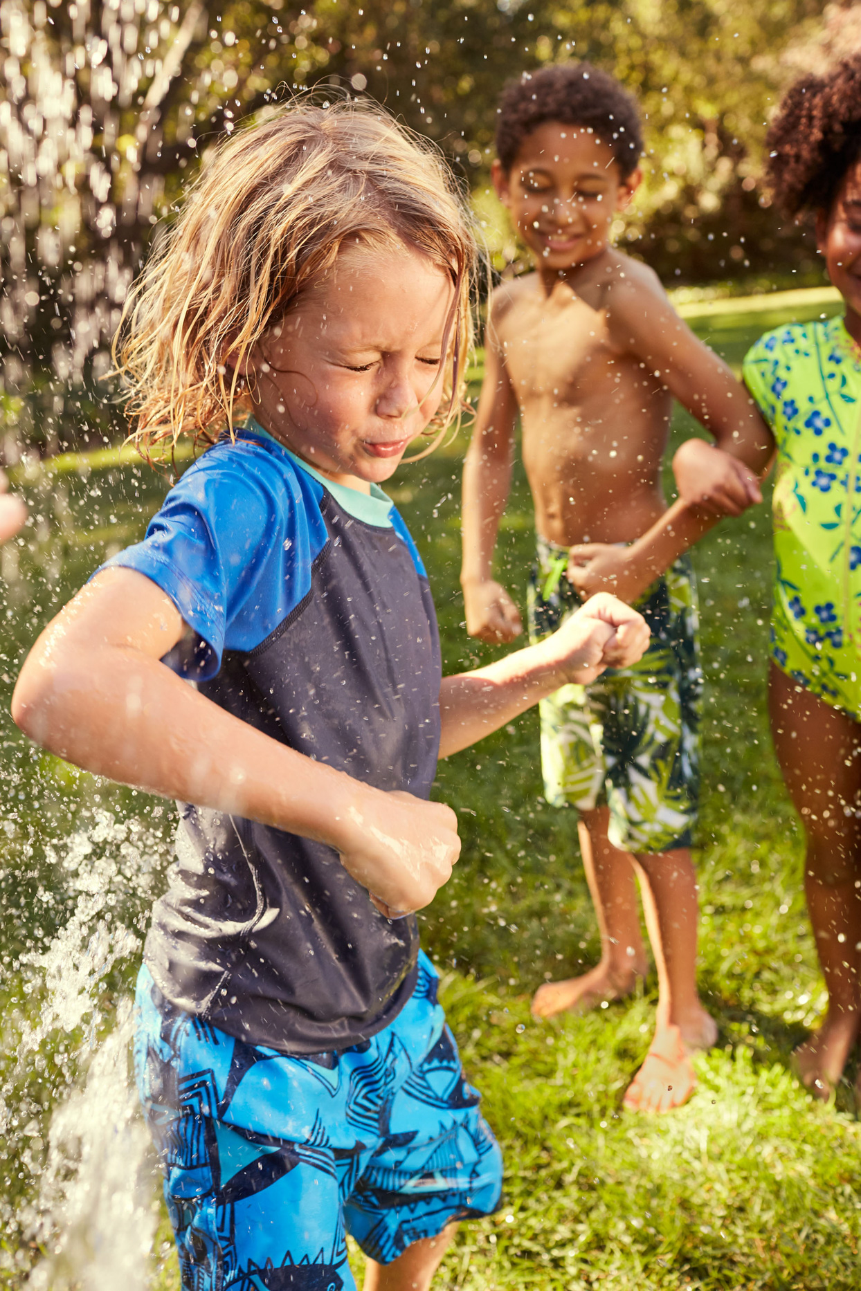 boys playing with the hose