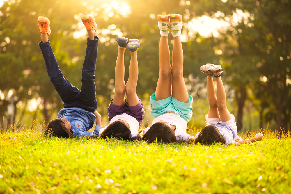 kids playing in grass outside