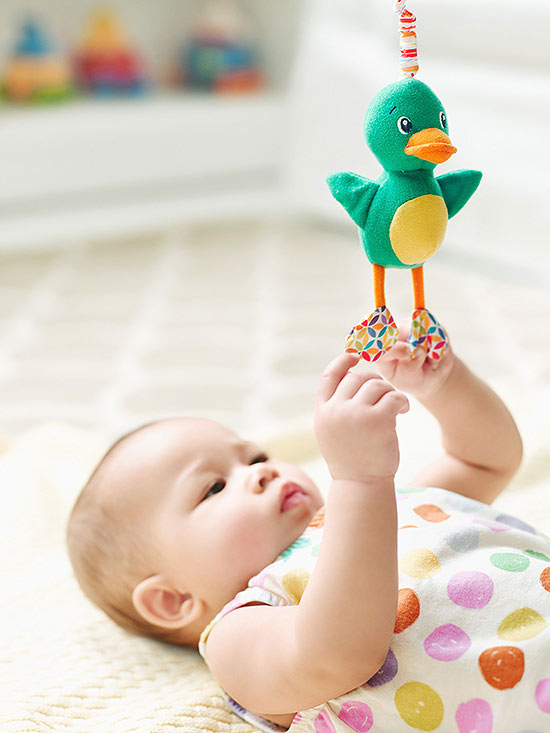 baby playing with toy