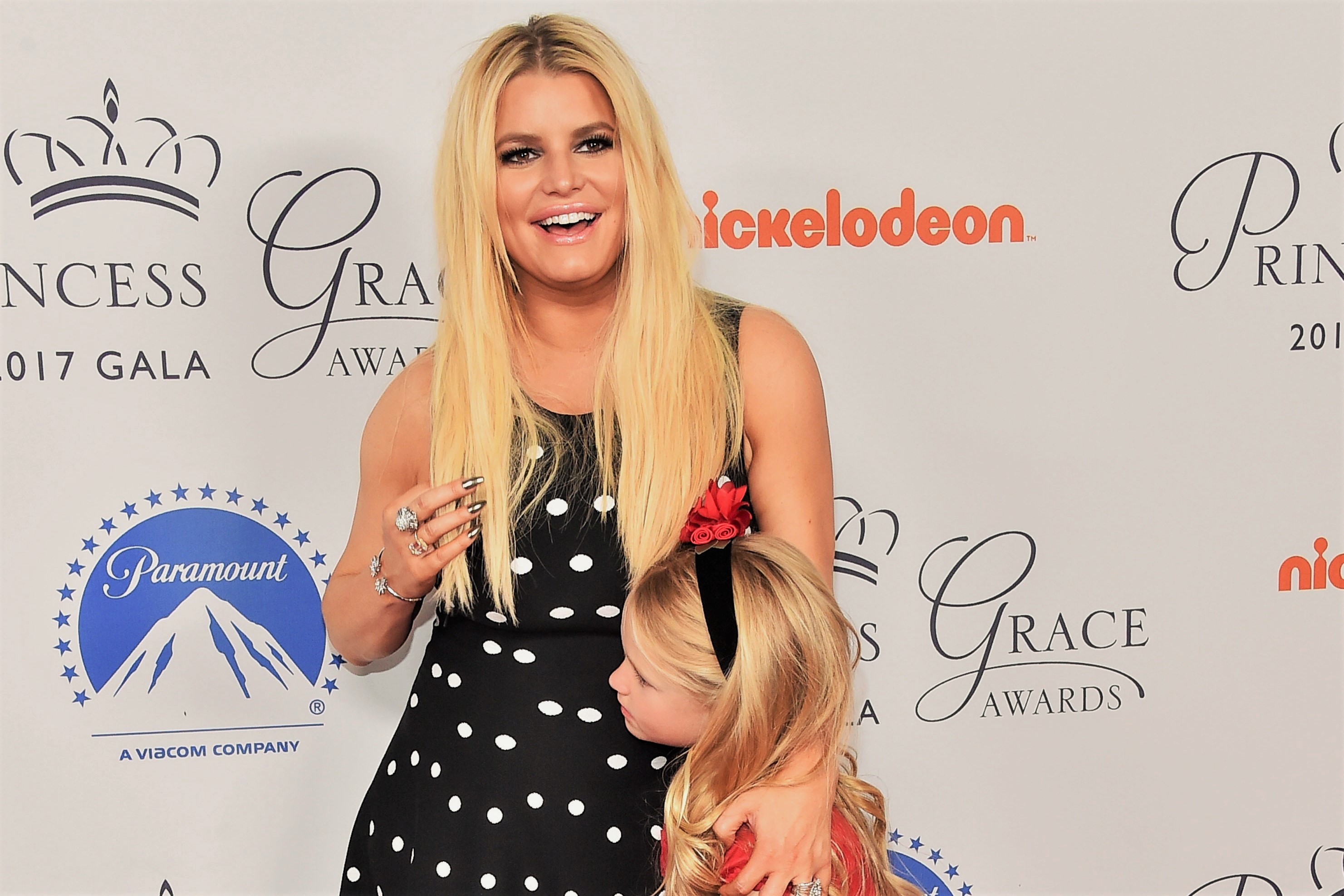 Jessica Simpson and Daughter Black White Polka Dot Dress and Red Bow